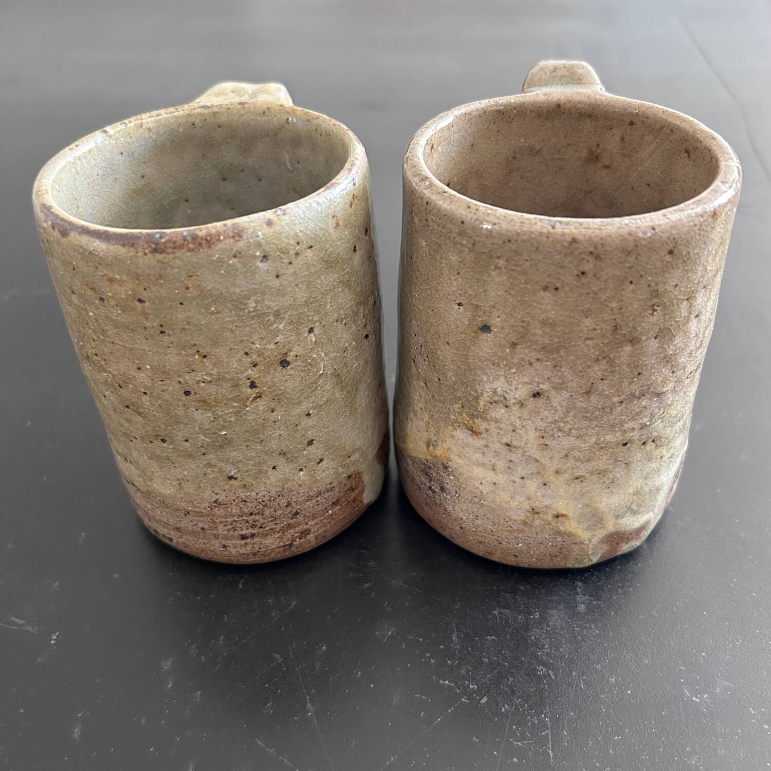 Pair of signed stoneware mugs