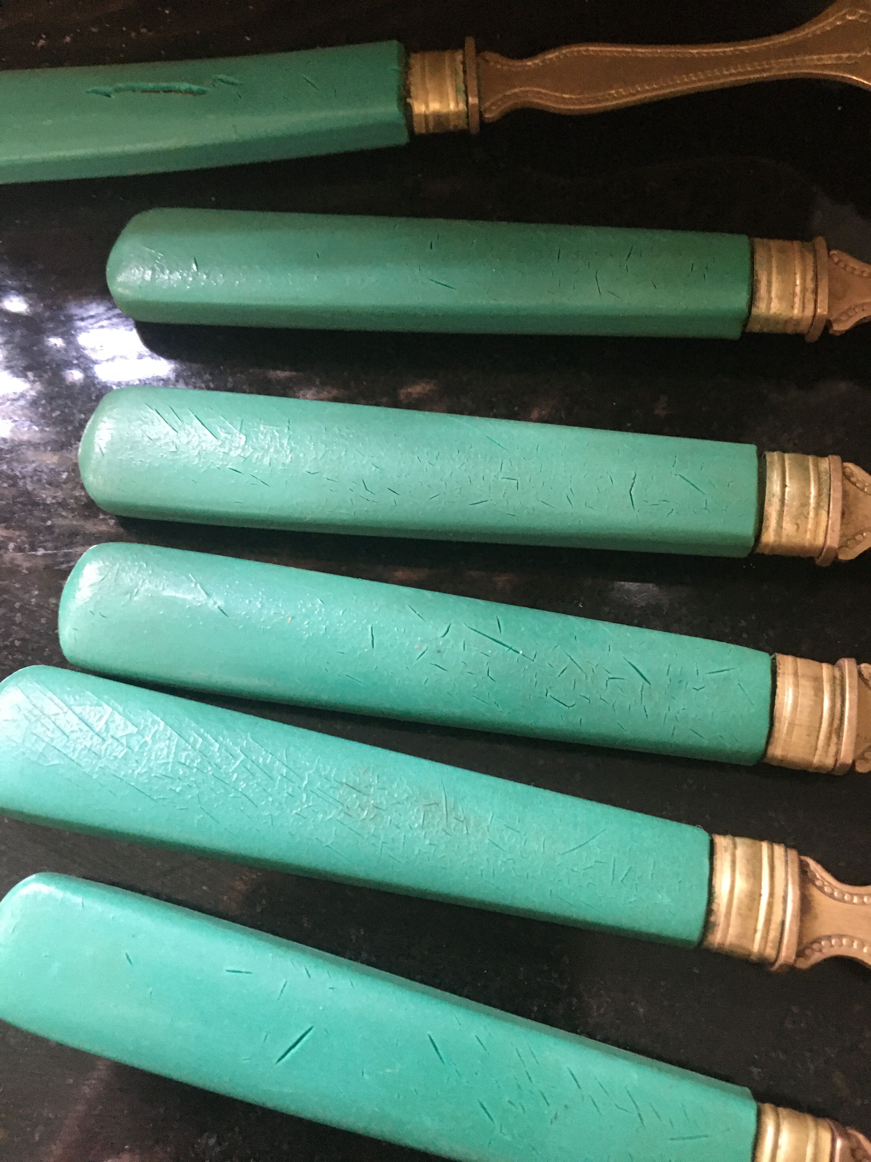 Set of brass dessert forks