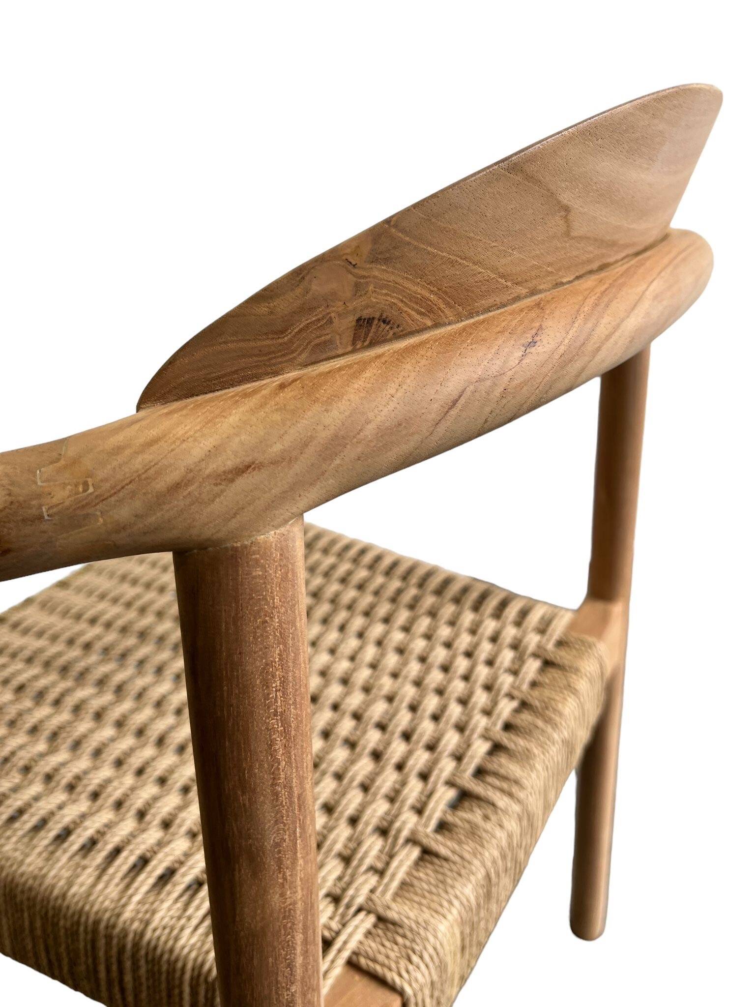 Solid wood chair with woven seat and armrests