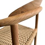 Solid wood chair with woven seat and armrests