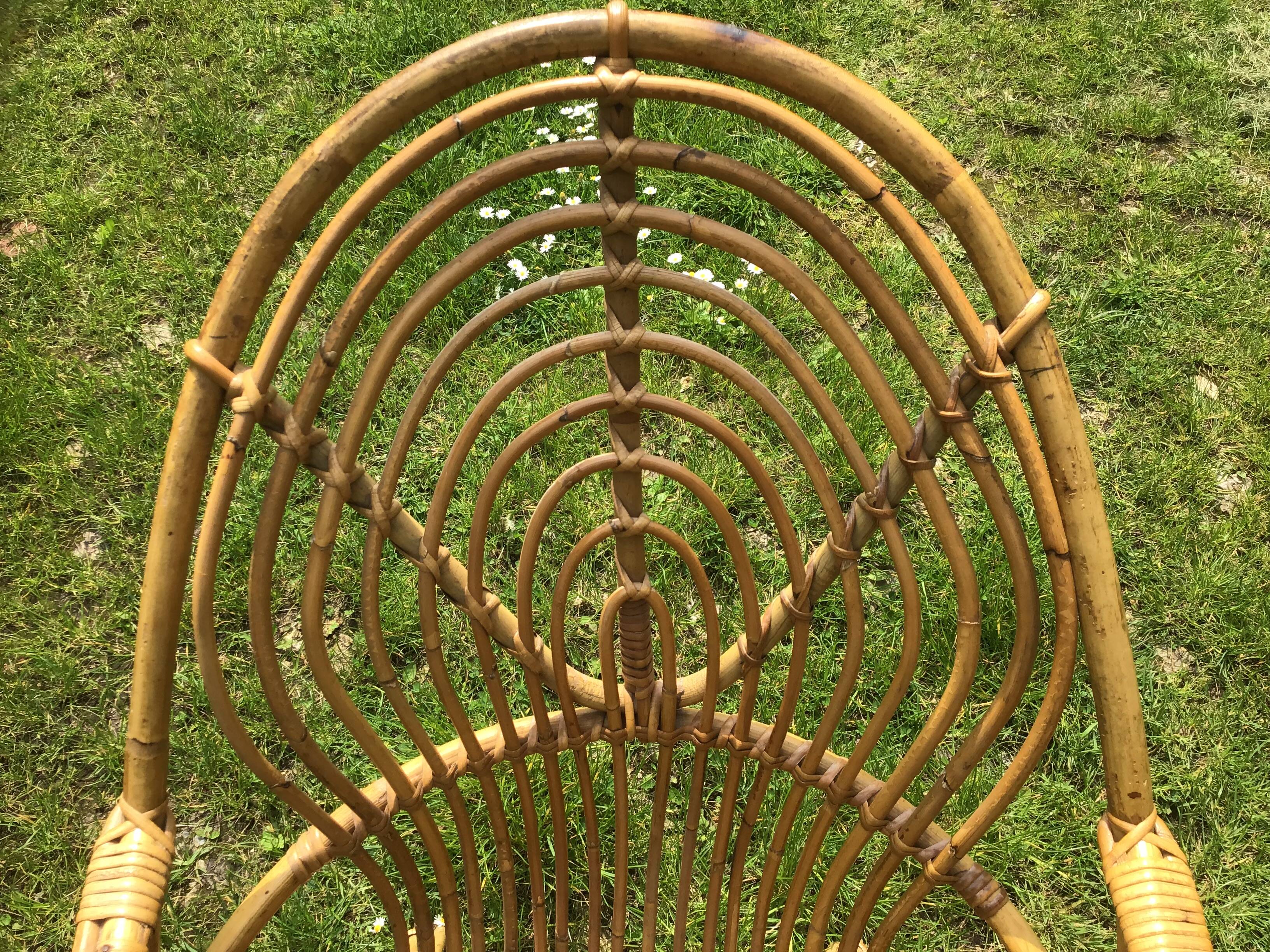 Vintage ovoid-shaped rattan armchair.