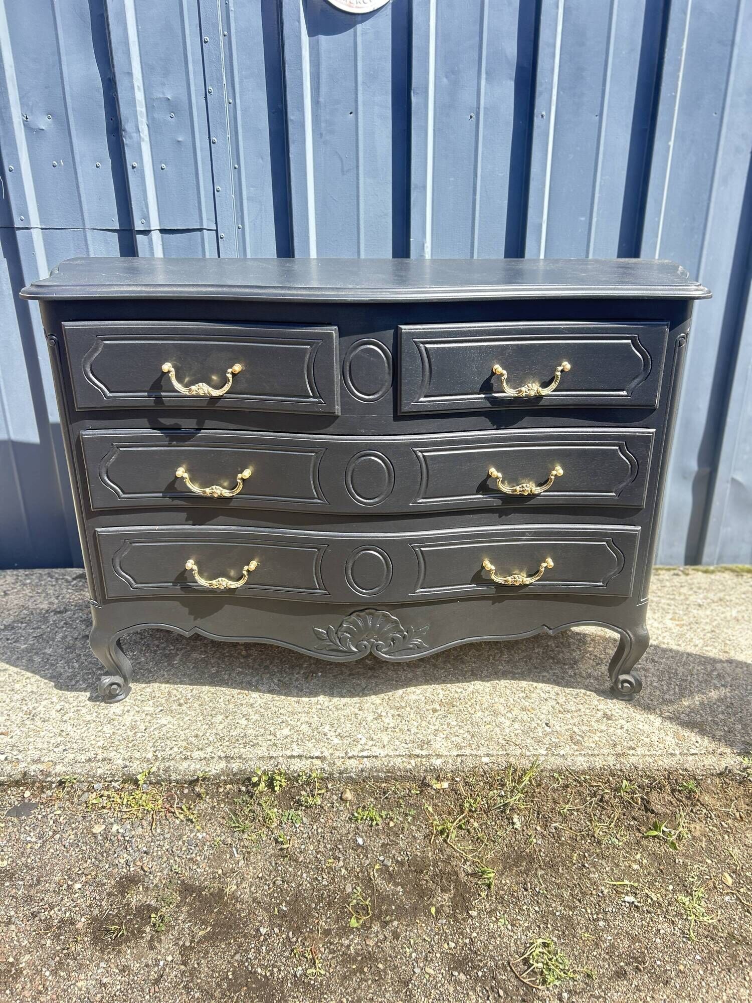 Louis XV style black lacquered chest of drawers with four drawers.