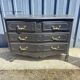 Louis XV style black lacquered chest of drawers with four drawers.