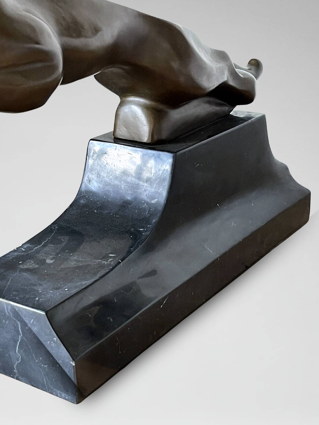 Large Art Deco bronze patinated Jaguar sculpture on an architectural base.