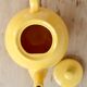 Vintage bright yellow ceramic teapot