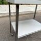 Rolling dessert trolley with 2 white formica shelves and steel, 1980.