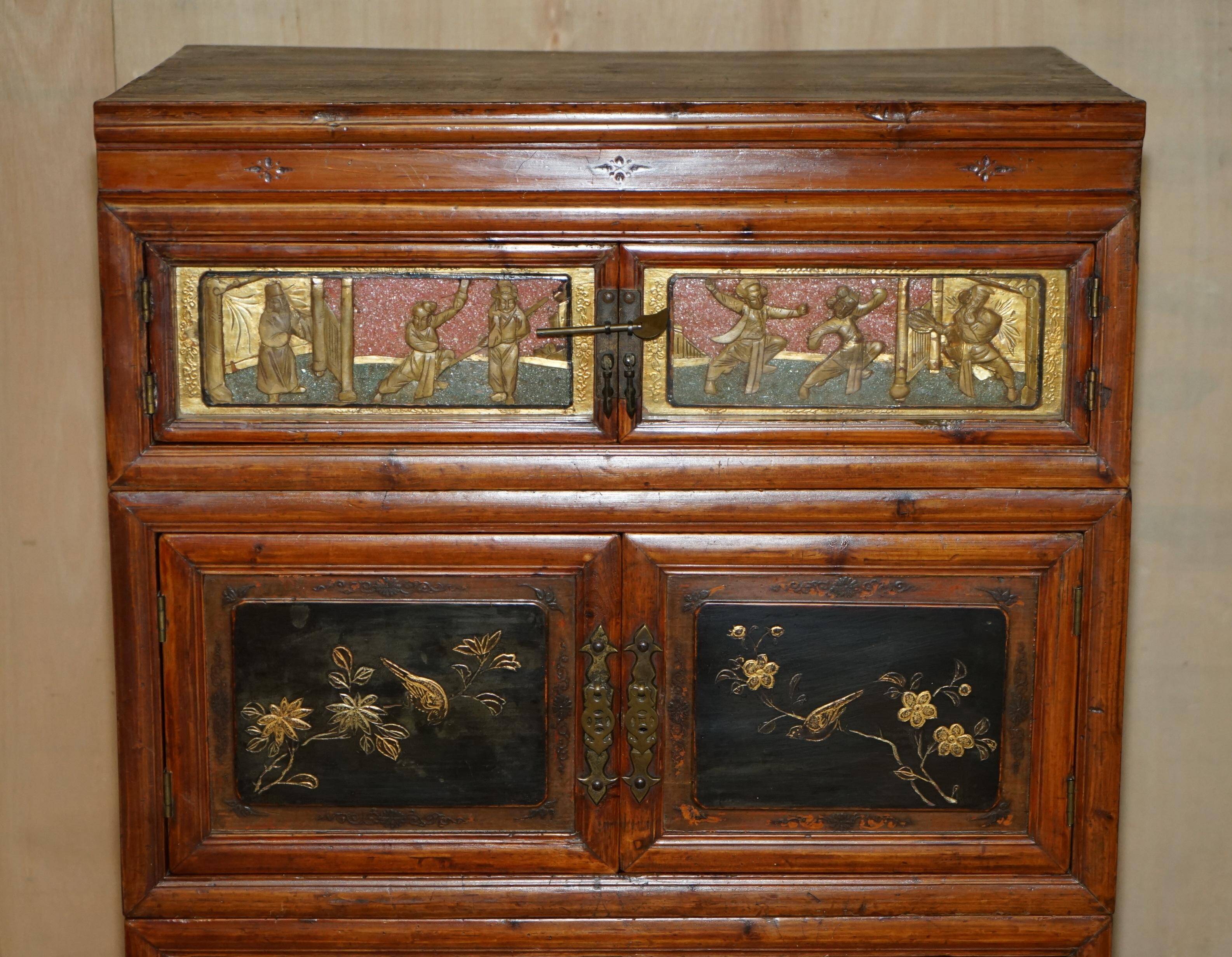 Antique Chinese armoire hand-carved around 1880 with country-style handles.