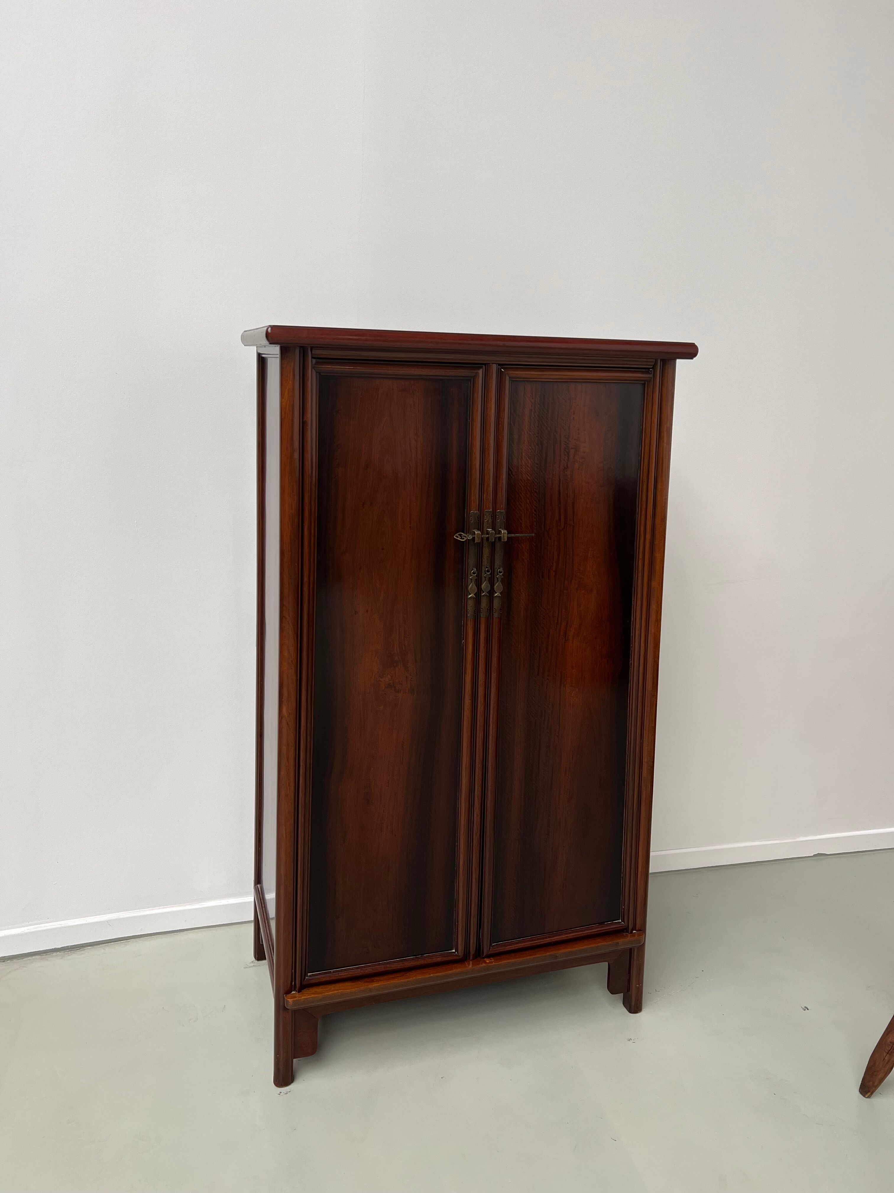 Chinese trapezoidal roller cabinet, made of rosewood.