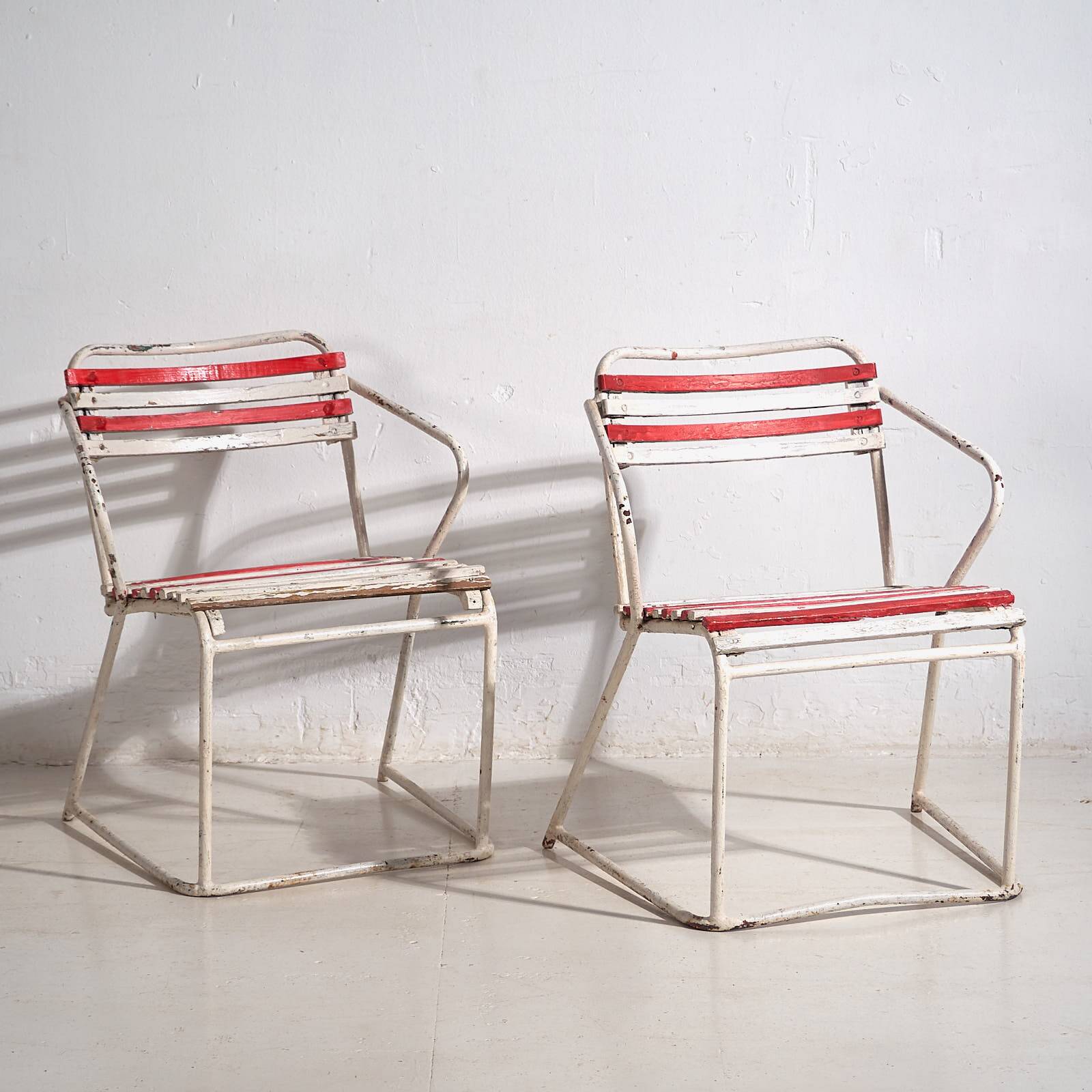 Antique outdoor stacking chairs (circa 1920). Set of 2 pieces.