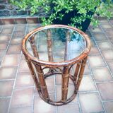 Round table in rattan and glass