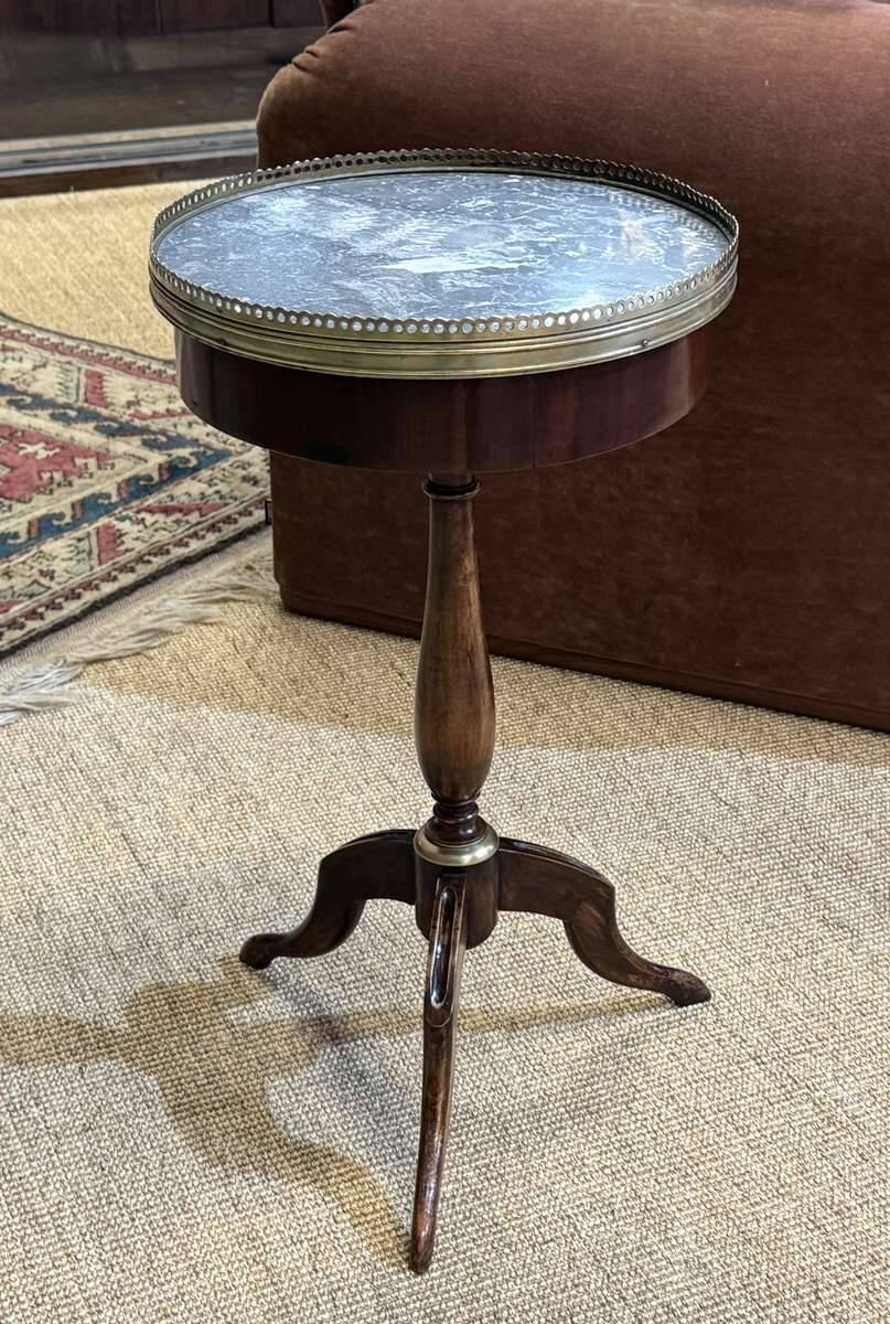 Mahogany gueridon with marble top from the 1950s.