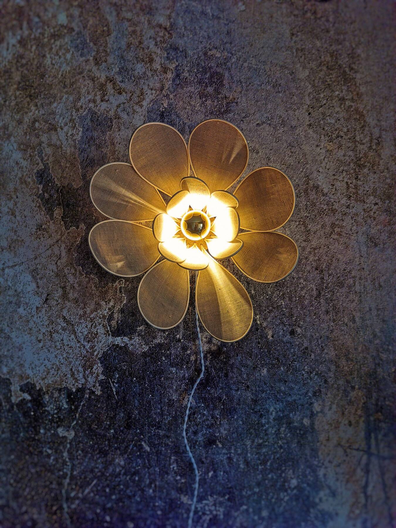 Flower wall light made of rattan and natural linen petals