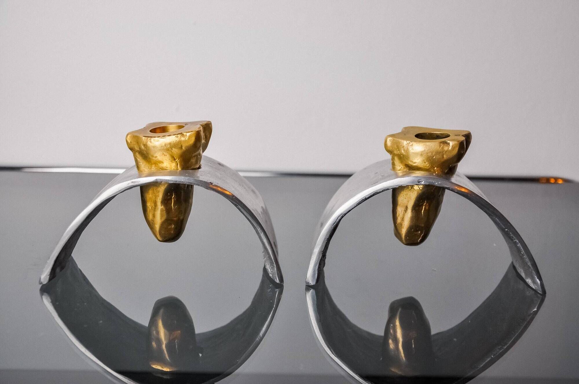 Pair of Brutalist candlesticks by David Marshall, bronze and aluminum, Spain, 1970