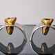 Pair of Brutalist candlesticks by David Marshall, bronze and aluminum, Spain, 1970