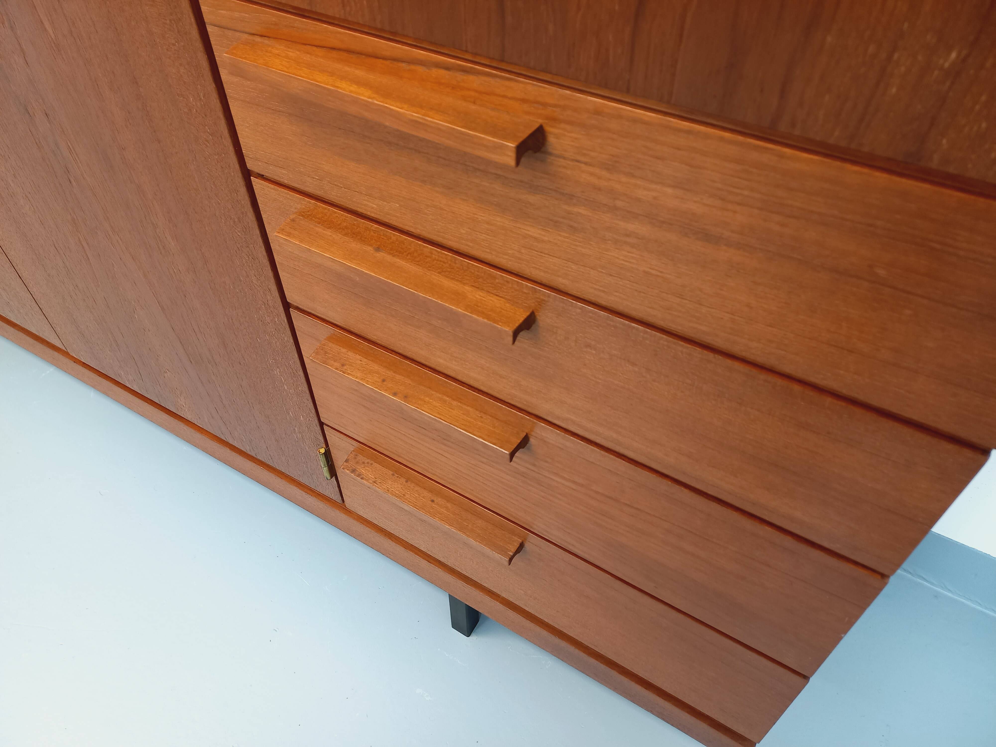 High Scandinavian modernist vintage sideboard in teak and black metal.