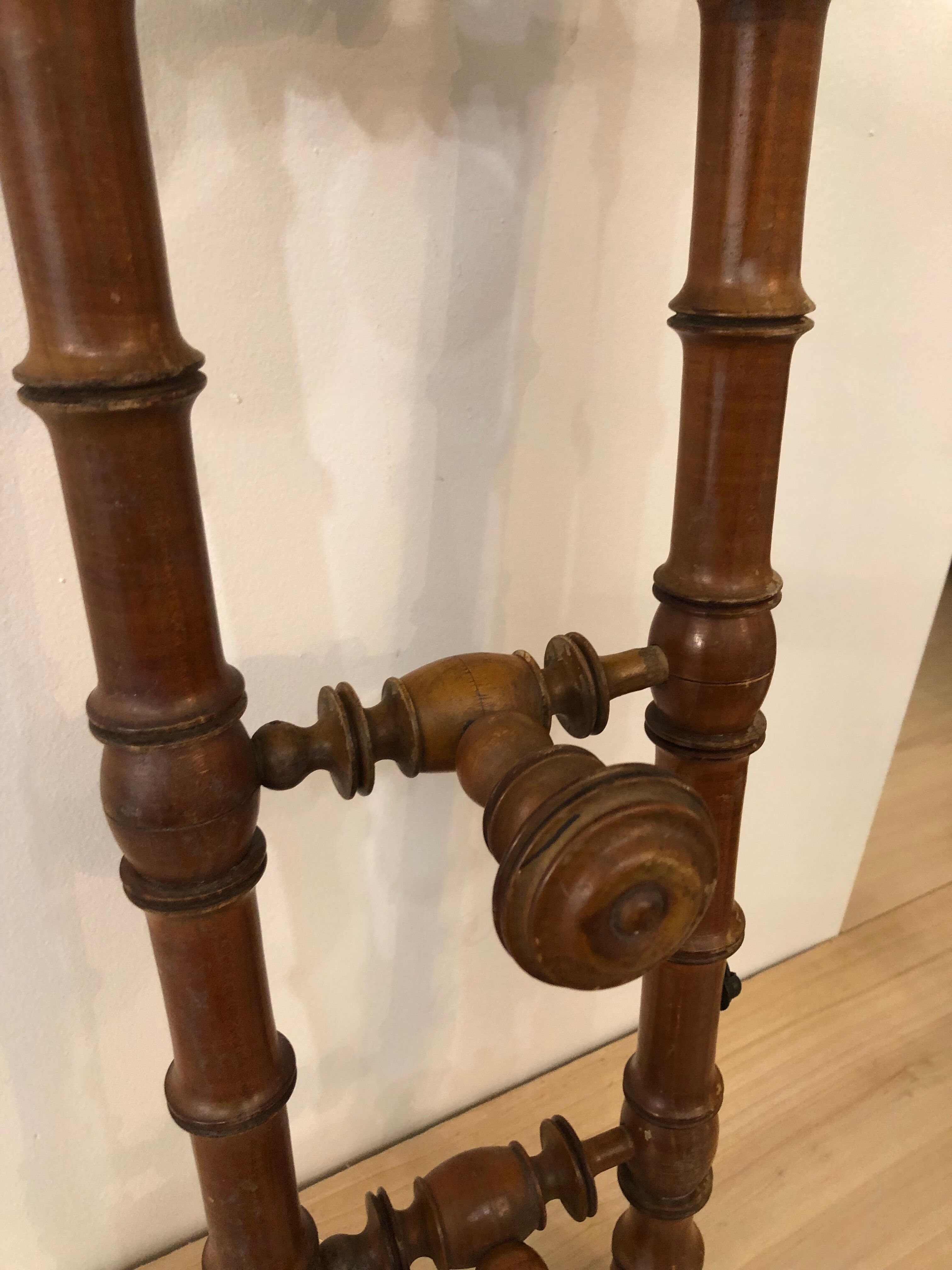 Wooden coat rack with swivel hooks