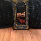 Small Ceramic Mirror with Mosaic Patterns and Yellow and Blue Paintings.