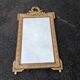 Large gold mirror in Louis XVI style with laurel crown, 121 cm.