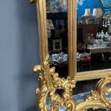 Mirror set with baroque style gilded wood console on marble top.