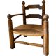 Straw and turned wood fireplace armchair in the style of Charles Dudouyt