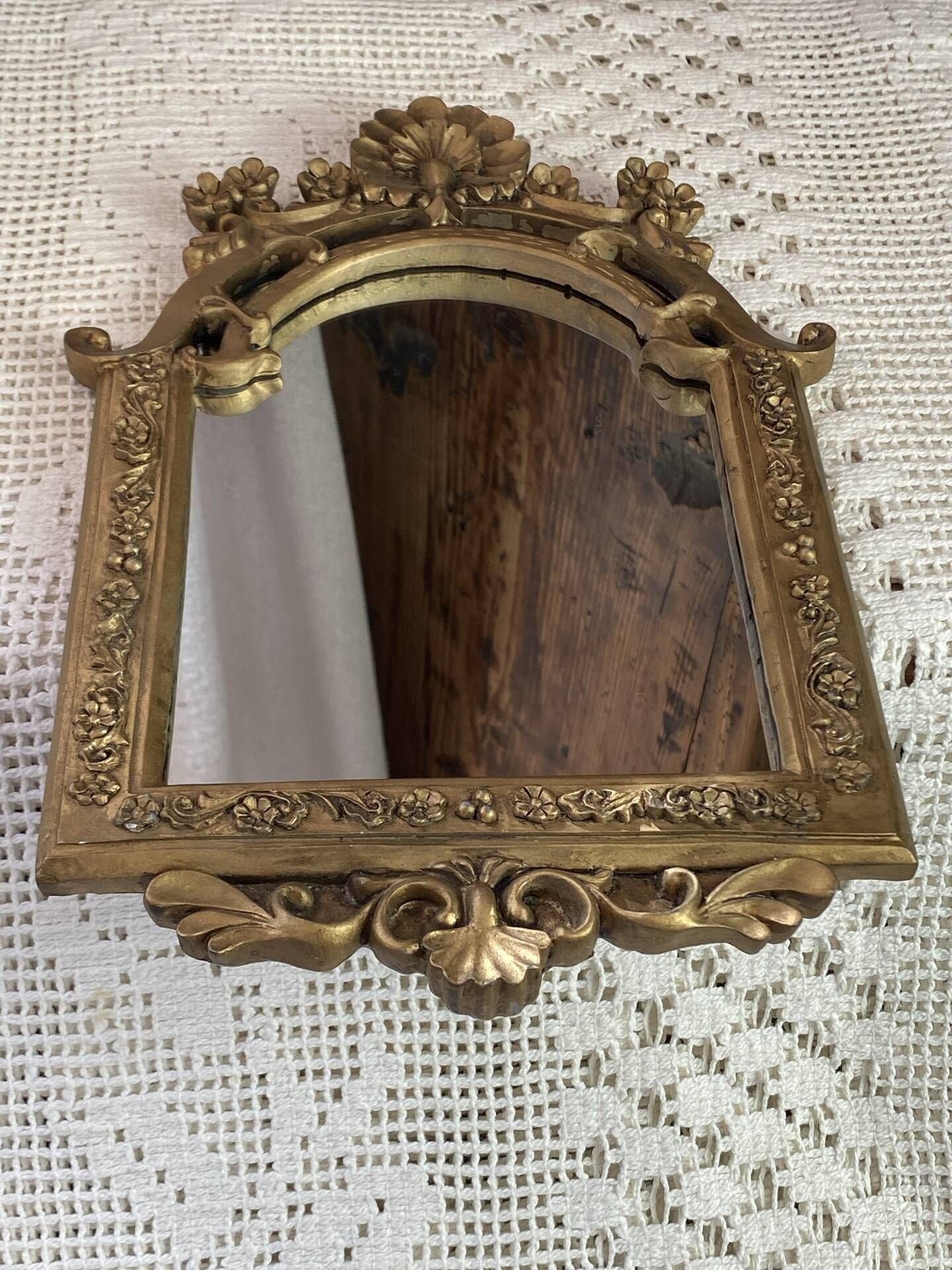 Baroque style mirror, decorated with shells and flowers.