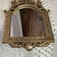Baroque style mirror, decorated with shells and flowers.