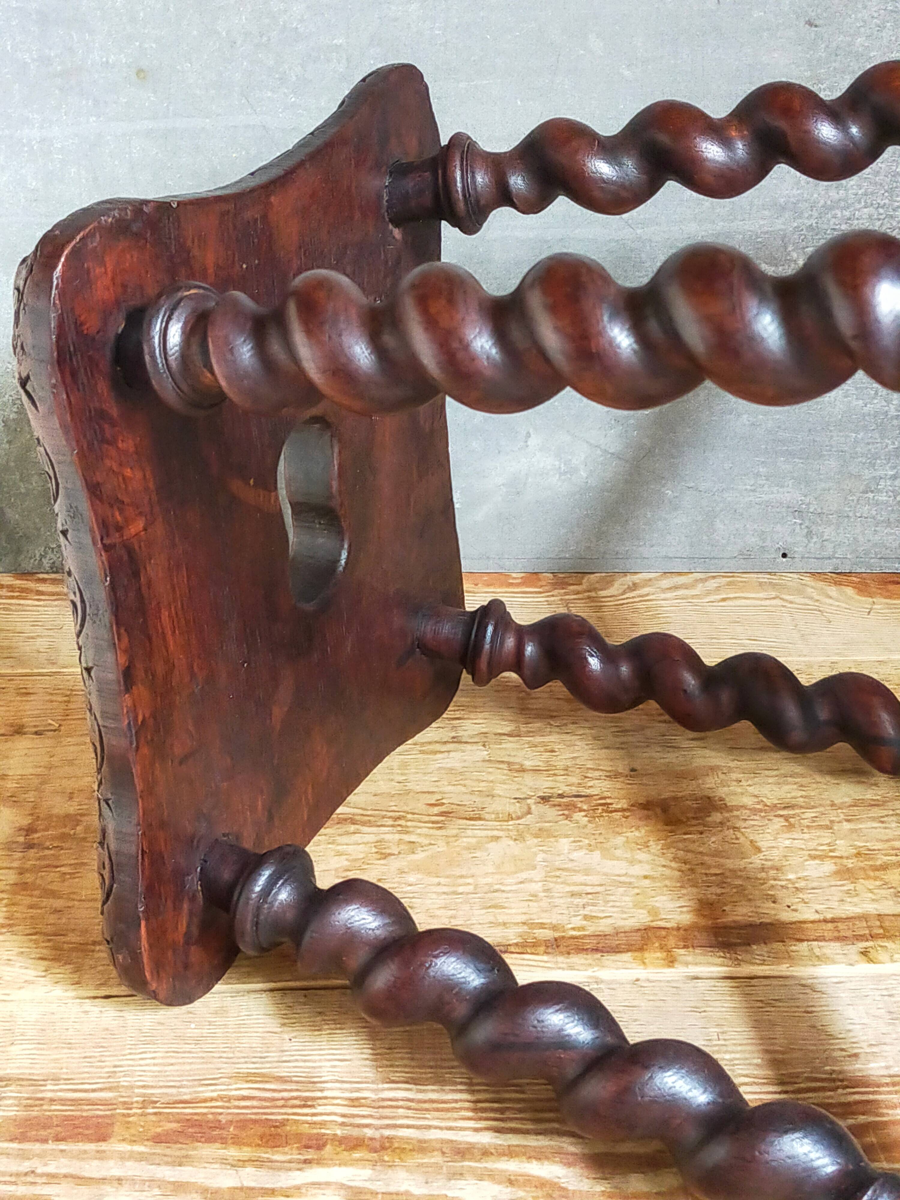 Antique stool in turned and carved solid wood