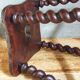 Antique stool in turned and carved solid wood
