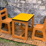 Children's wooden and formica desk and sled chairs 1970