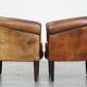 Set of 2 subtle, stately and sturdy club chairs made of sheepskin