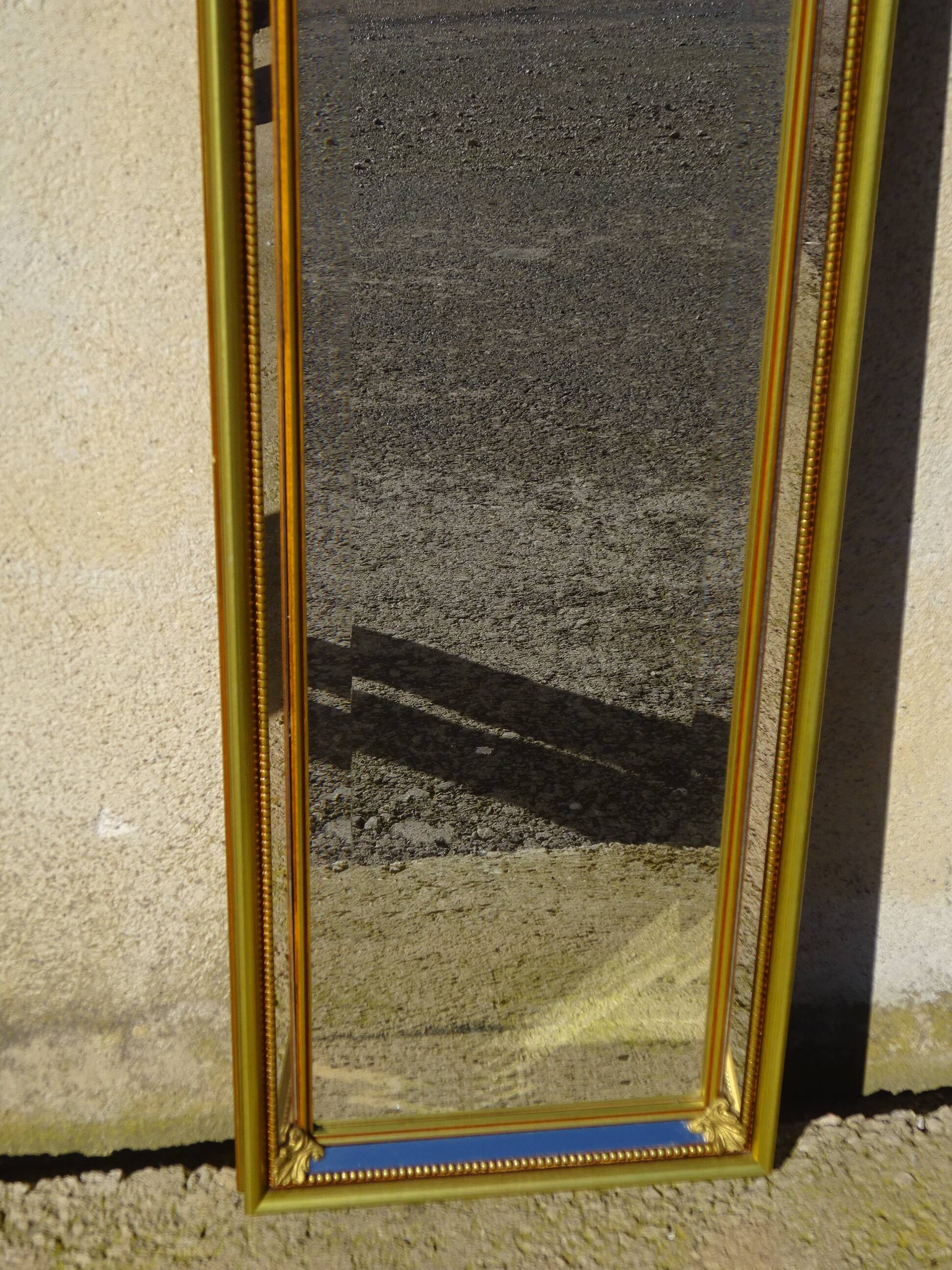 Hall mirror, gilded frame with fillets and fleur-de-lis.