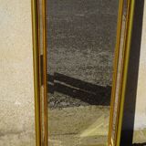 Hall mirror, gilded frame with fillets and fleur-de-lis.