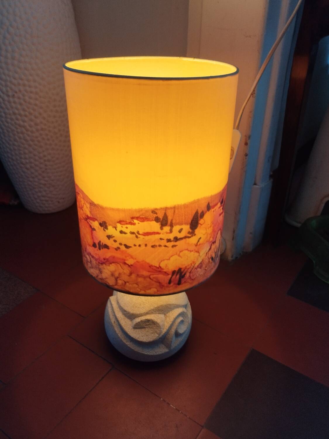 Vintage antique lamp with a stone base.