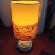 Vintage antique lamp with a stone base.