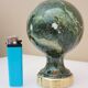Stair railing ball in enameled cast iron imitating veined green, sea green marble.