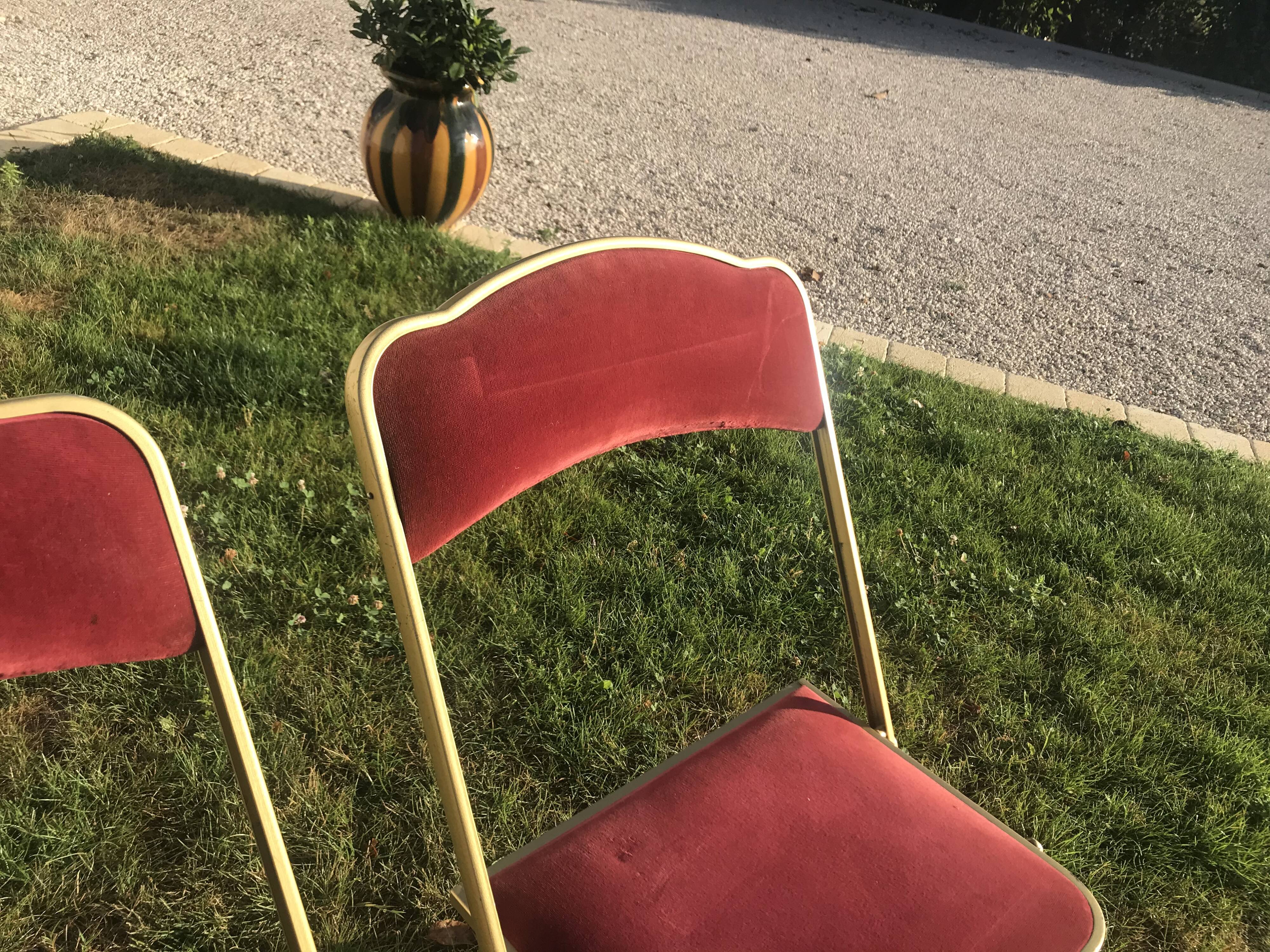 Pair of foldable red velvet chairs