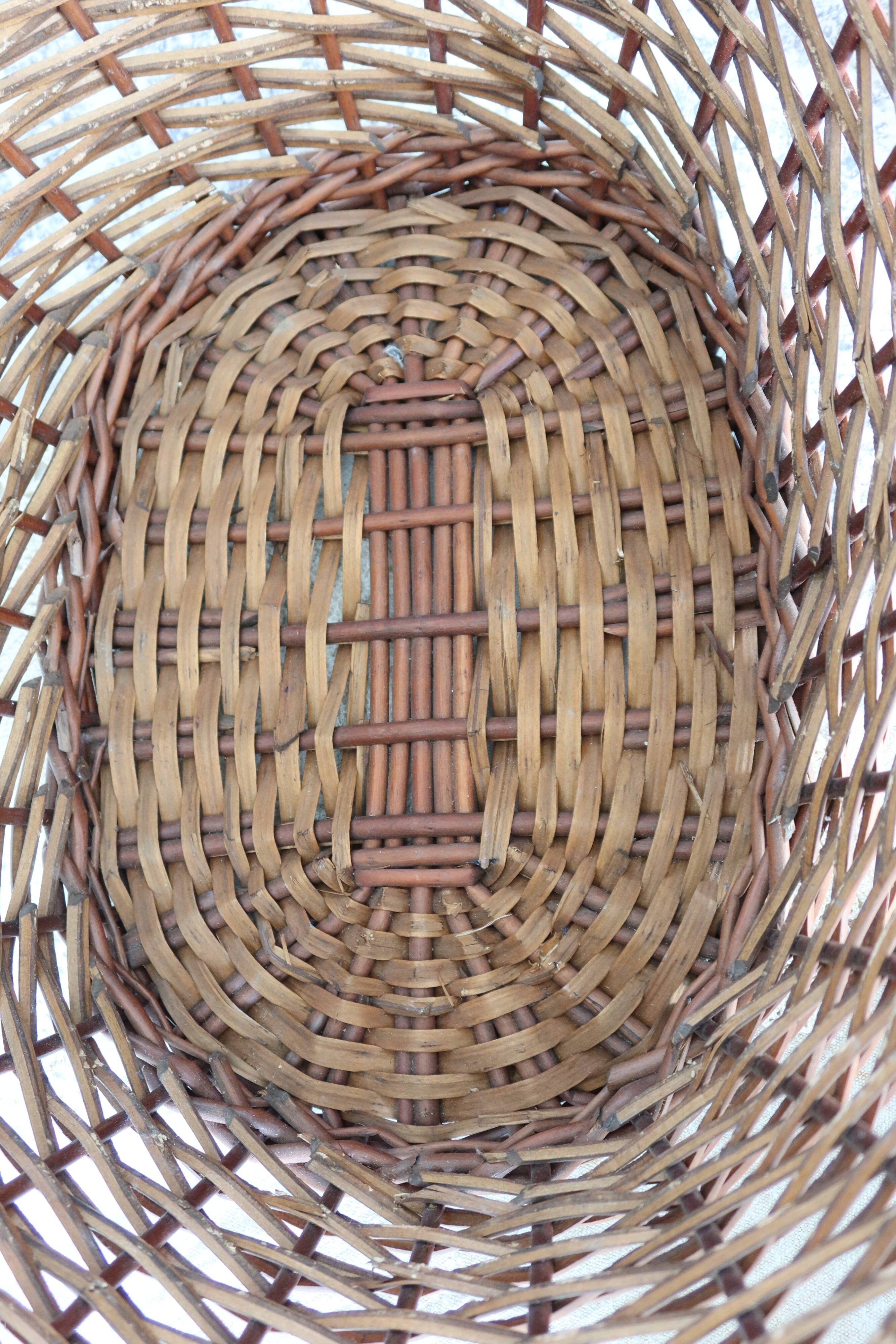 Large vintage dark wicker basket with handles