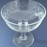 Suite of six champagne glasses on foot in engraved colorless crystal