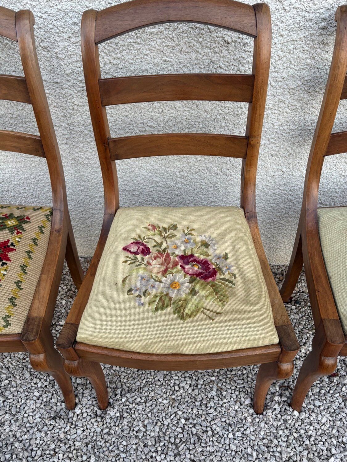 Set of three Louis XV chairs in solid walnut with petit point upholstery from the 19th century.