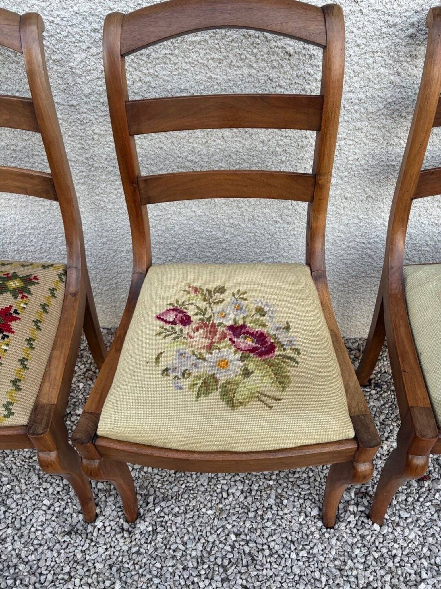 Set of three Louis XV chairs in solid walnut with petit point upholstery from the 19th century.