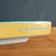 Yellow glazed ceramic trivet signed l. drimmer