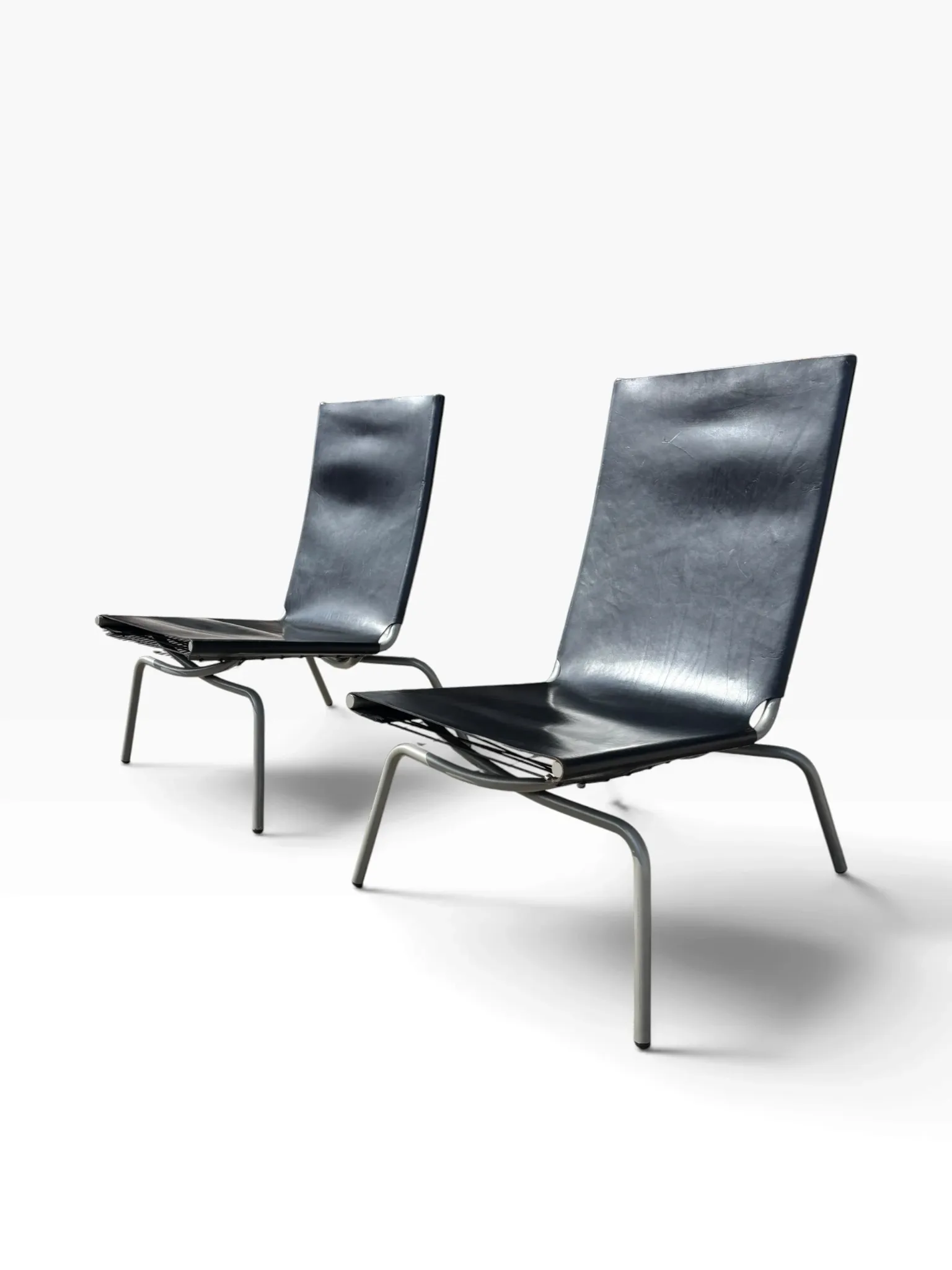 Set of 2 Crossed Legged lounge chairs by Fabiaan van Severen.