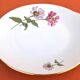 Serving dish with handles, fine Bohemian porcelain with floral decoration on a background.