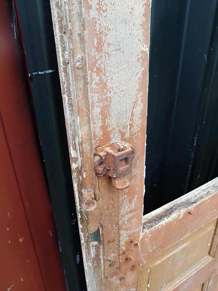 Ancient paneled solid oak door with 3 windows