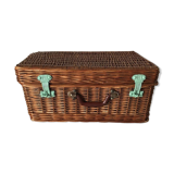 Wicker suitcase to store toys.