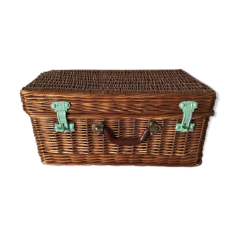 Wicker suitcase to store toys.