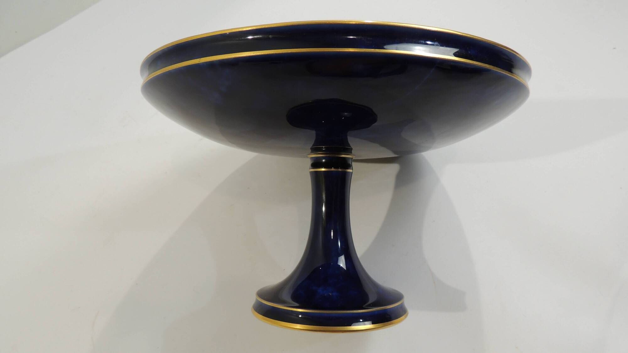 Sèvres porcelain cobalt blue footed bowl with gold rim – center
