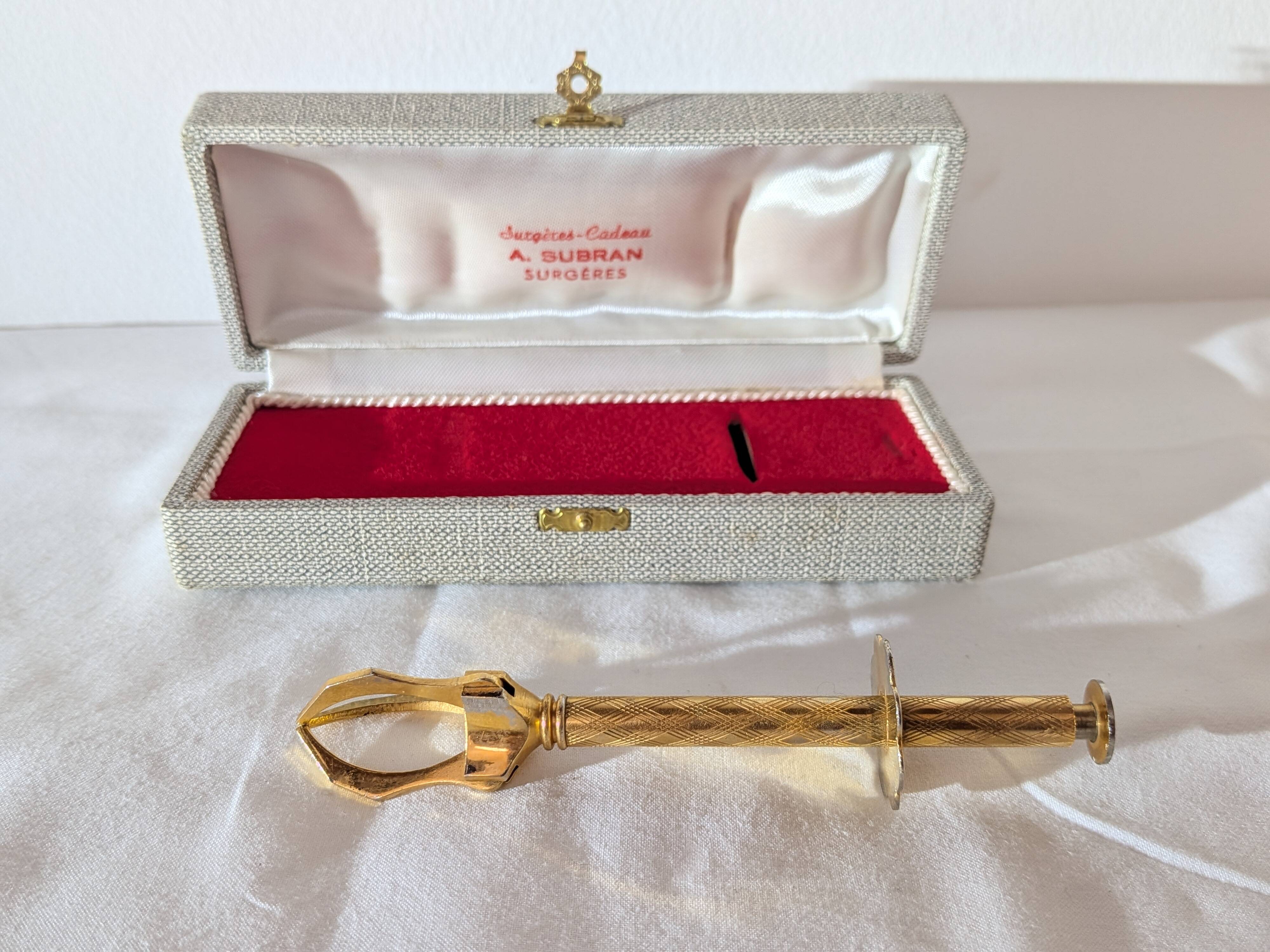 Vintage gold sugar tongs with case