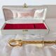 Vintage gold sugar tongs with case