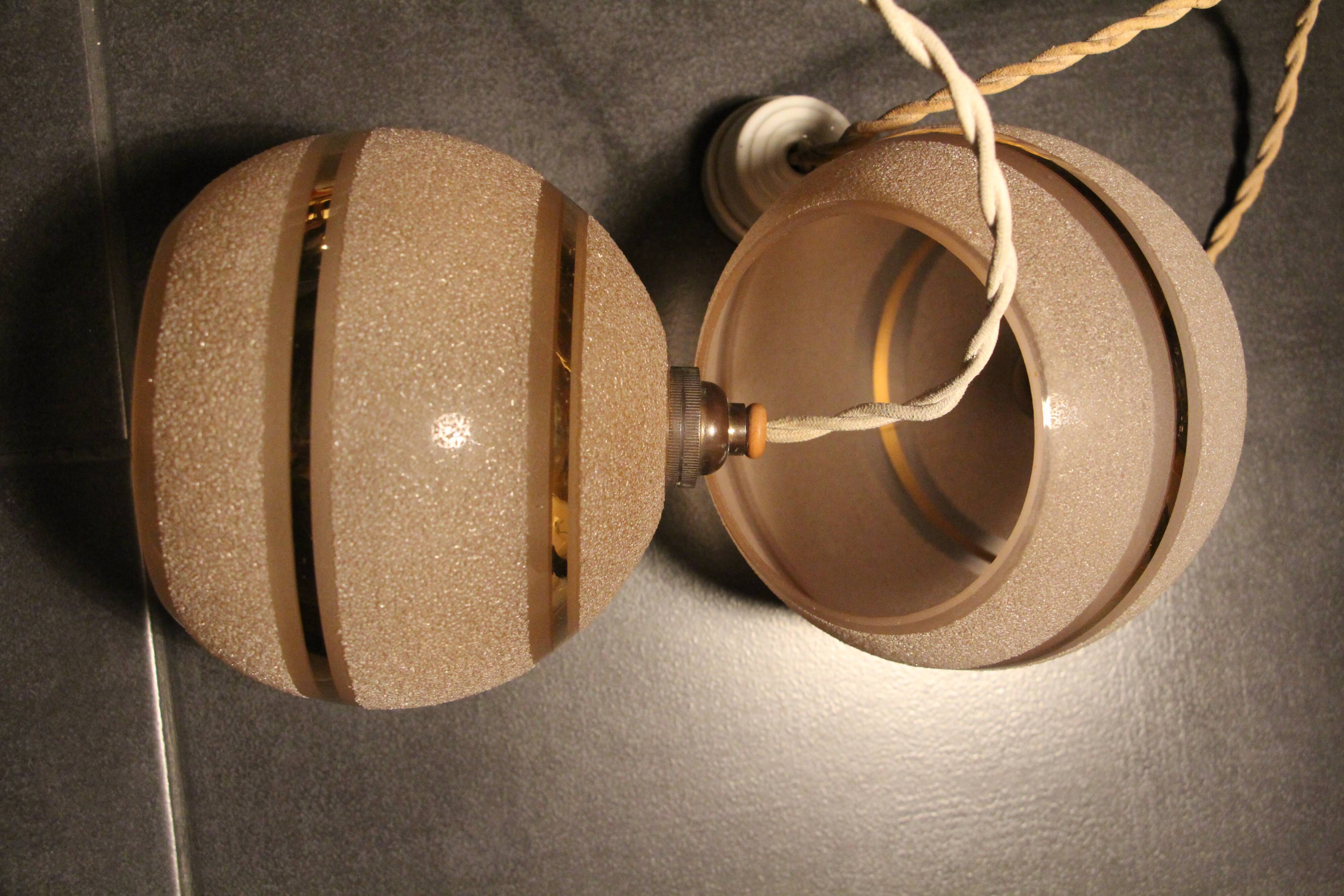 Set of two Art Deco pendant lamps in pink and gold glass